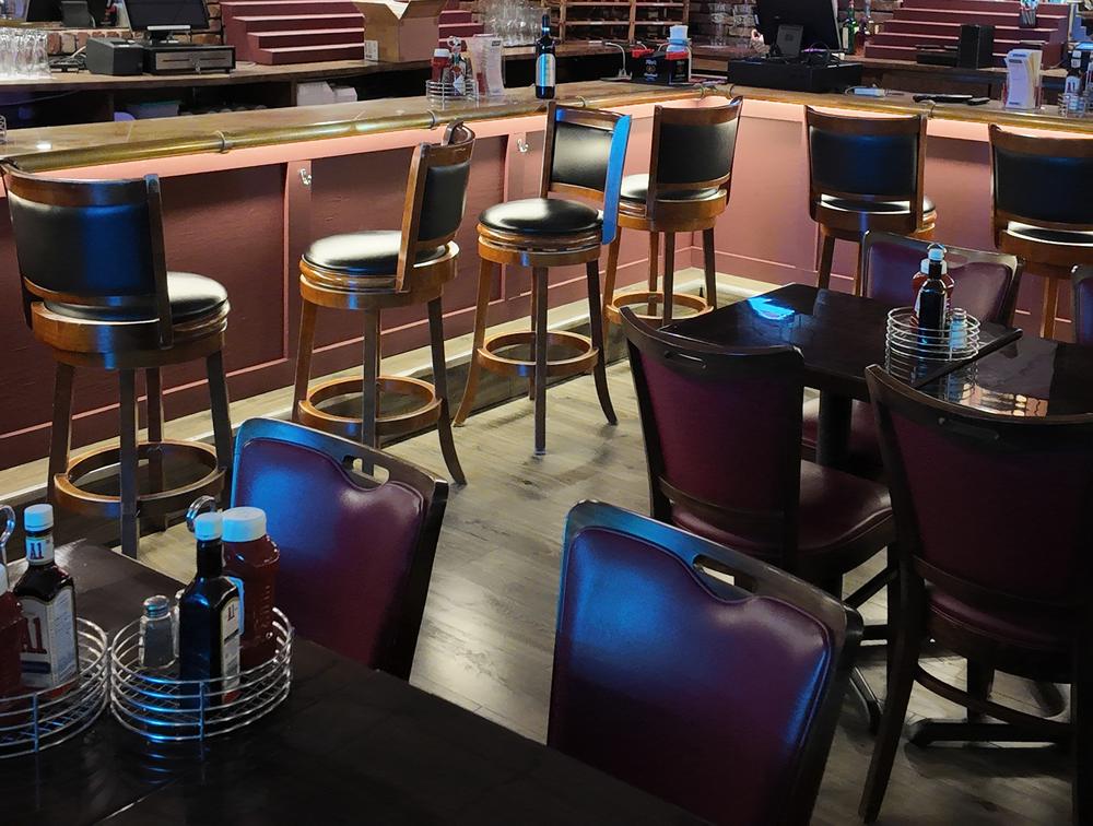 Dining tables and bar stools inside Little Venice